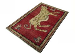 Corner detail of 2000s Persian Gabbeh rug showing border pattern and Wool pile