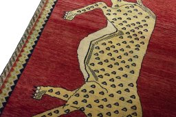Backside of handmade 2000s Persian Gabbeh rug showing knot structure and weave density