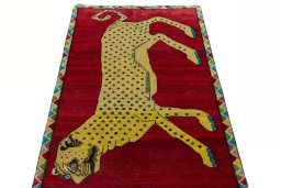 Surface texture of 2000s Persian Gabbeh rug with natural Wool and intricate pattern