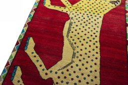 Backside of handmade 2000s Persian Gabbeh rug showing knot structure and weave density
