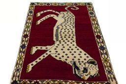 Surface texture of 2000s Persian Gabbeh rug with natural Wool and intricate pattern