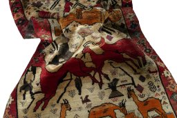 Corner detail of 2000s Persian Gabbeh rug showing border pattern and Wool pile