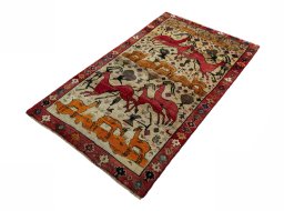 Corner detail of 2000s Persian Gabbeh rug showing border pattern and Wool pile