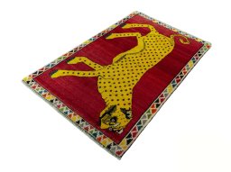 Corner detail of 2000s Persian Gabbeh rug showing border pattern and Wool pile