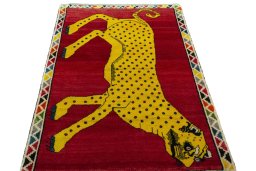 Surface texture of 2000s Persian Gabbeh rug with natural Wool and intricate pattern