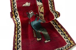 Corner detail of 2000s Persian Gabbeh rug showing border pattern and Wool pile
