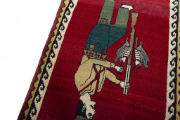 Backside of handmade 2000s Persian Gabbeh rug showing knot structure and weave density