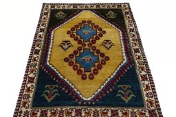 Surface texture of 2000s Persian Gabbeh rug with natural Wool and intricate pattern