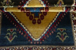 Full view of 2000s Persian Gabbeh rug from Iran / Persia, 160 × 109 cm in Yellow tones