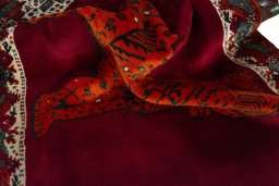 Corner detail of 2000s Persian Gabbeh rug showing border pattern and Wool pile