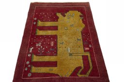 Surface texture of 2000s Persian Gabbeh rug with natural Wool and intricate pattern