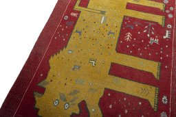 Backside of handmade 2000s Persian Gabbeh rug showing knot structure and weave density