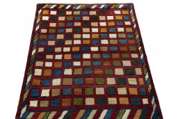 Surface texture of 2000s Persian Gabbeh rug with natural Wool and intricate pattern