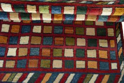 Full view of 2000s Persian Gabbeh rug from Iran / Persia, 132 × 105 cm in Red tones