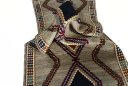 Corner detail of 2000s Persian Gabbeh rug showing border pattern and Wool pile