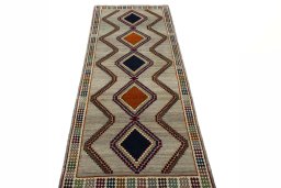 Surface texture of 2000s Persian Gabbeh rug with natural Wool and intricate pattern