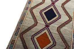 Backside of handmade 2000s Persian Gabbeh rug showing knot structure and weave density