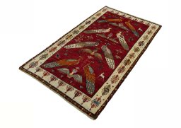 Corner detail of 2000s Persian Gabbeh rug showing border pattern and Wool pile