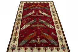 Surface texture of 2000s Persian Gabbeh rug with natural Wool and intricate pattern