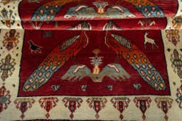 Full view of 2000s Persian Gabbeh rug from Iran / Persia, 222 × 132 cm in Red tones