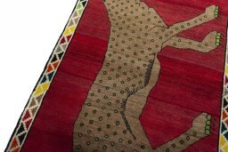 Backside of handmade 2000s Persian Gabbeh rug showing knot structure and weave density