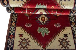 Corner detail of 2000s Persian Gabbeh rug showing border pattern and Wool pile