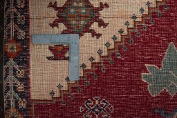 Surface texture of 2000s Persian Gabbeh rug with natural Wool and intricate pattern