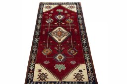 Surface texture of 2000s Persian Gabbeh rug with natural Wool and intricate pattern