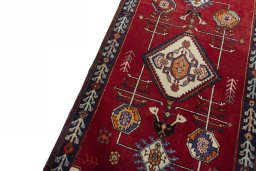 Backside of handmade 2000s Persian Gabbeh rug showing knot structure and weave density