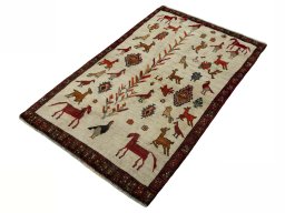 Corner detail of 2000s Persian Gabbeh rug showing border pattern and Wool pile