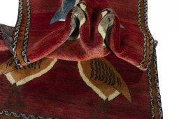 Corner detail of 2000s Persian Gabbeh rug showing border pattern and Wool pile