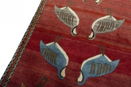 Backside of handmade 2000s Persian Gabbeh rug showing knot structure and weave density