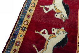 Backside of handmade 2000s Persian Gabbeh rug showing knot structure and weave density