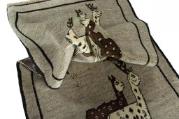 Corner detail of 2000s Persian Gabbeh rug showing border pattern and Wool pile