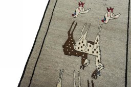 Backside of handmade 2000s Persian Gabbeh rug showing knot structure and weave density