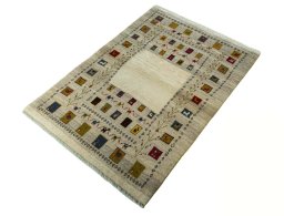 Corner detail of 2000s Persian Gabbeh rug showing border pattern and Wool pile