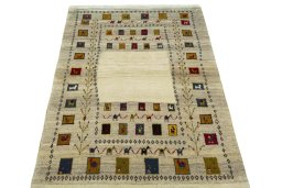 Surface texture of 2000s Persian Gabbeh rug with natural Wool and intricate pattern
