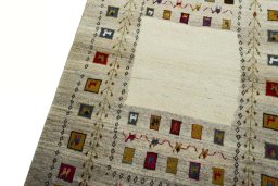 Backside of handmade 2000s Persian Gabbeh rug showing knot structure and weave density