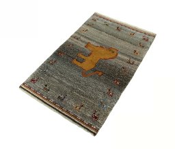 Corner detail of 2000s Persian Gabbeh rug showing border pattern and Wool pile