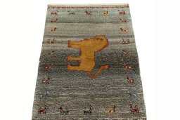 Surface texture of 2000s Persian Gabbeh rug with natural Wool and intricate pattern