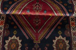 Corner detail of 2000s Persian Gabbeh rug showing border pattern and Wool pile