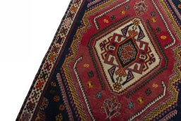 Backside of handmade 2000s Persian Gabbeh rug showing knot structure and weave density