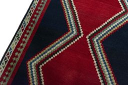 Backside of handmade 2000s Persian Gabbeh rug showing knot structure and weave density