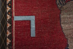 Close-up detail of 2000s Persian Gabbeh rug from Iran / Persia showing Wool weave