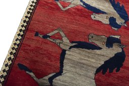 Backside of handmade 2000s Persian Gabbeh rug showing knot structure and weave density