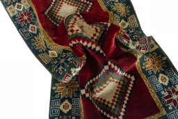 Corner detail of 2000s Persian Gabbeh rug showing border pattern and Wool pile