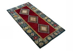 Close-up detail of 2000s Persian Gabbeh rug from Iran / Persia showing Wool weave