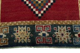 Central medallion detail of 2000s Persian Gabbeh rug from Iran / Persia
