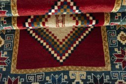 Full view of 2000s Persian Gabbeh rug from Iran / Persia, 156 × 83 cm in Red tones