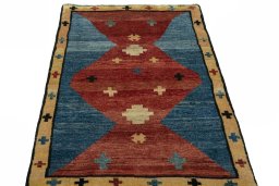 Surface texture of 2000s Persian Gabbeh rug with natural Wool and intricate pattern